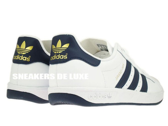 G64079 adidas Grand Prix White / New Navy / Metallic Gold